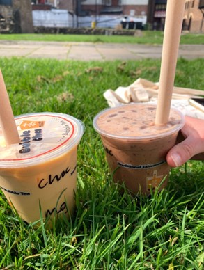 Two bubble tea drinks on the grass