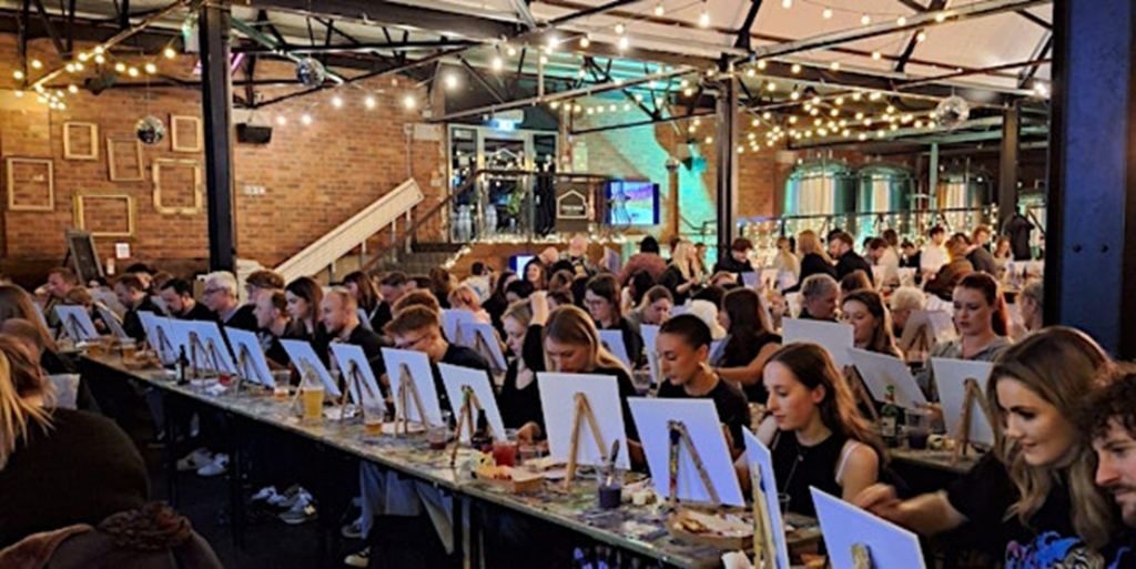 People with mini easels painting in Tyne Bank Brewery