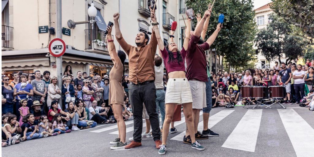 Posse, group of people arms up in street