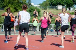 People doing exercise class outside