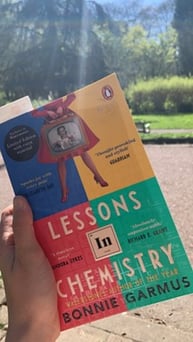 A photo of the book Lessons in Chemistry, taken in the park on a sunny day by the author of this article 