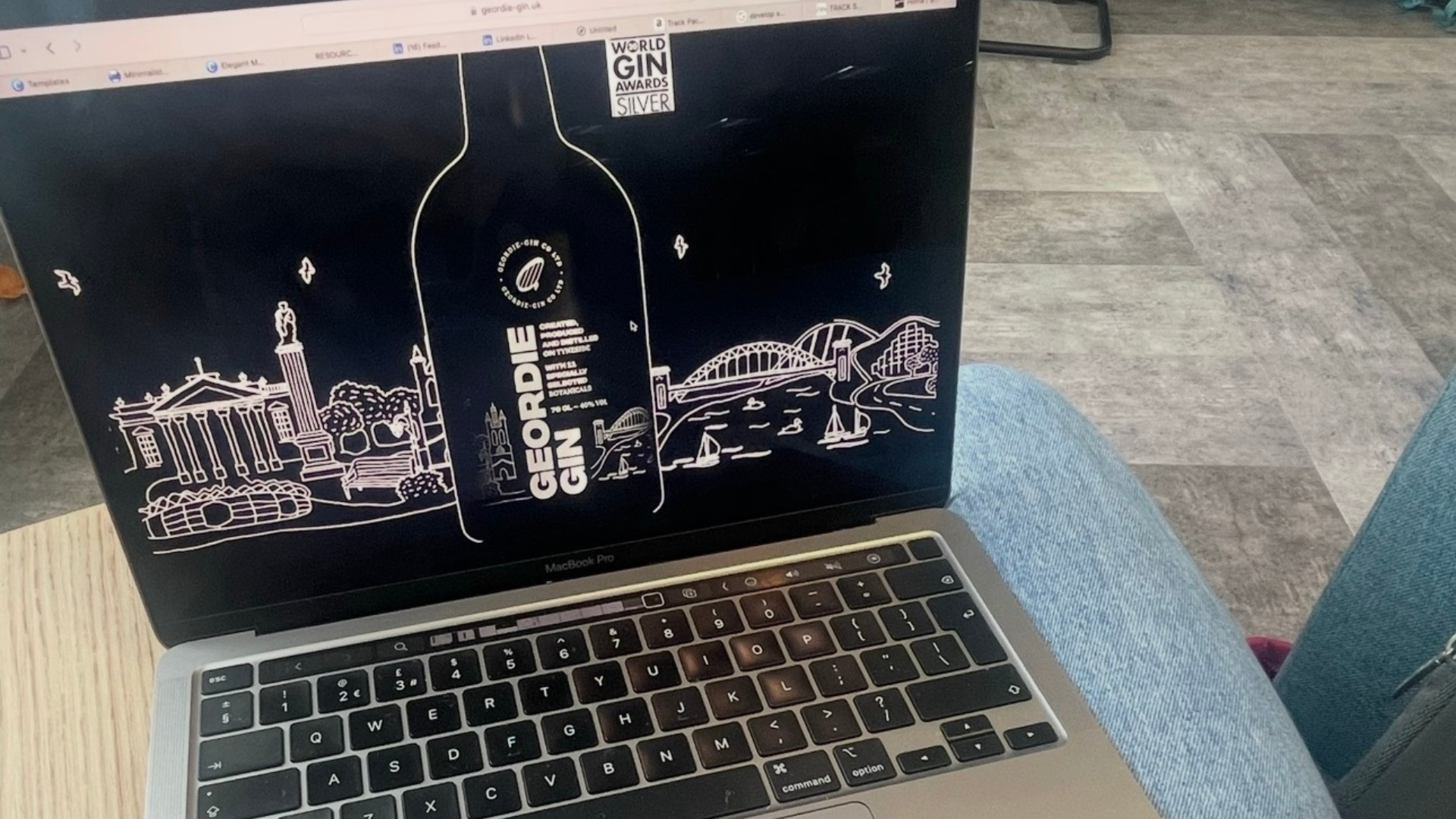 Geordie Gin landing page on a laptop