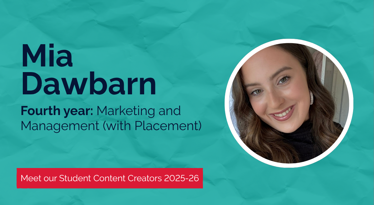 Mia Dawbarn, a fourth-year Marketing and Management (with Placement) student and 2025–26 Student Content Creator at Newcastle University, smiling indoors with curled hair and wearing a black top