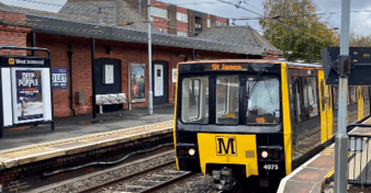 Image of West Jesmond metro station with a train on the platform