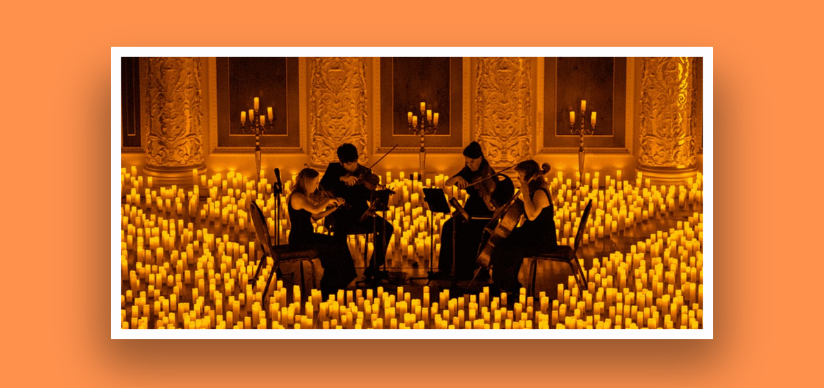4 people playing instruments with lots of candles 
