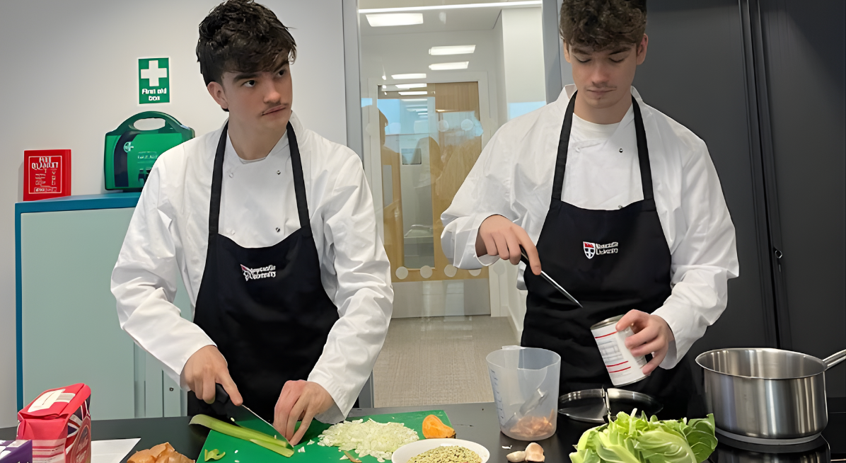 image of two chefs preparing vegetables