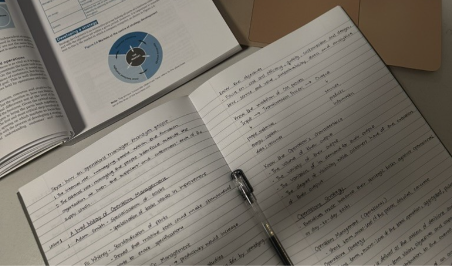 Notes in a notepad with pen