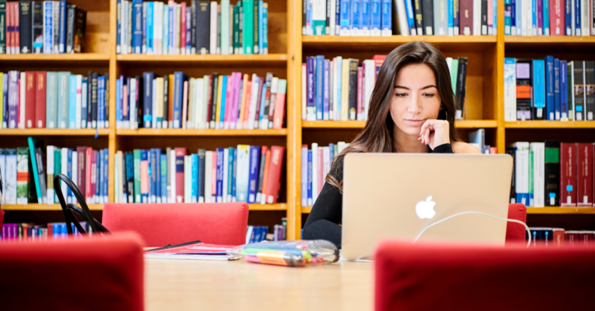 How_to_revise_for_essay_exams_girl_student_studying_in_library