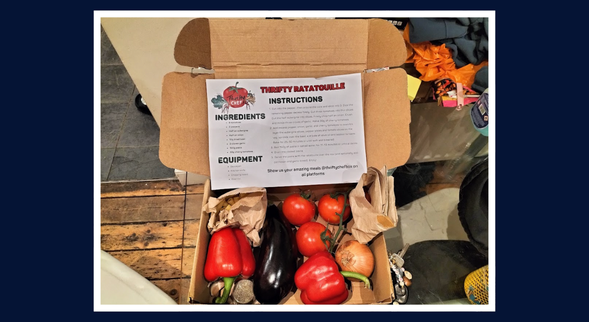Thrifty Ratatouille - image of a recipe card, cardboard box, and various vegetables including tomato, pepper, aubergine, and onion
