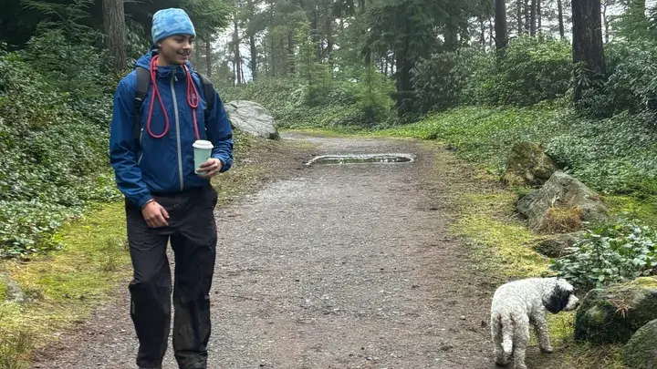Jack walking in the forest with a dog